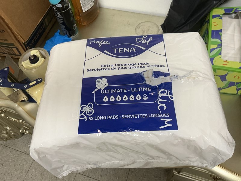 Condition photo showing New/Like New for similar, package is ripped. tena sensitive care incontinence pads, postpartum & bladder control pads for women, ultimate absorbency, extra coverage, long, 52 count