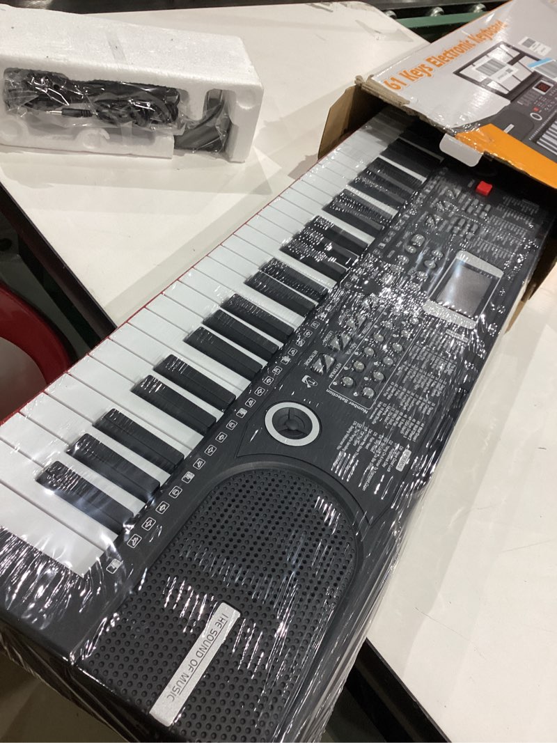 Condition photo showing New/Like New for 61 keys keyboard piano, electronic digital piano with built-in speaker microphone, sheet stand and power supply, portable piano keyboard gift teaching for beginners black
