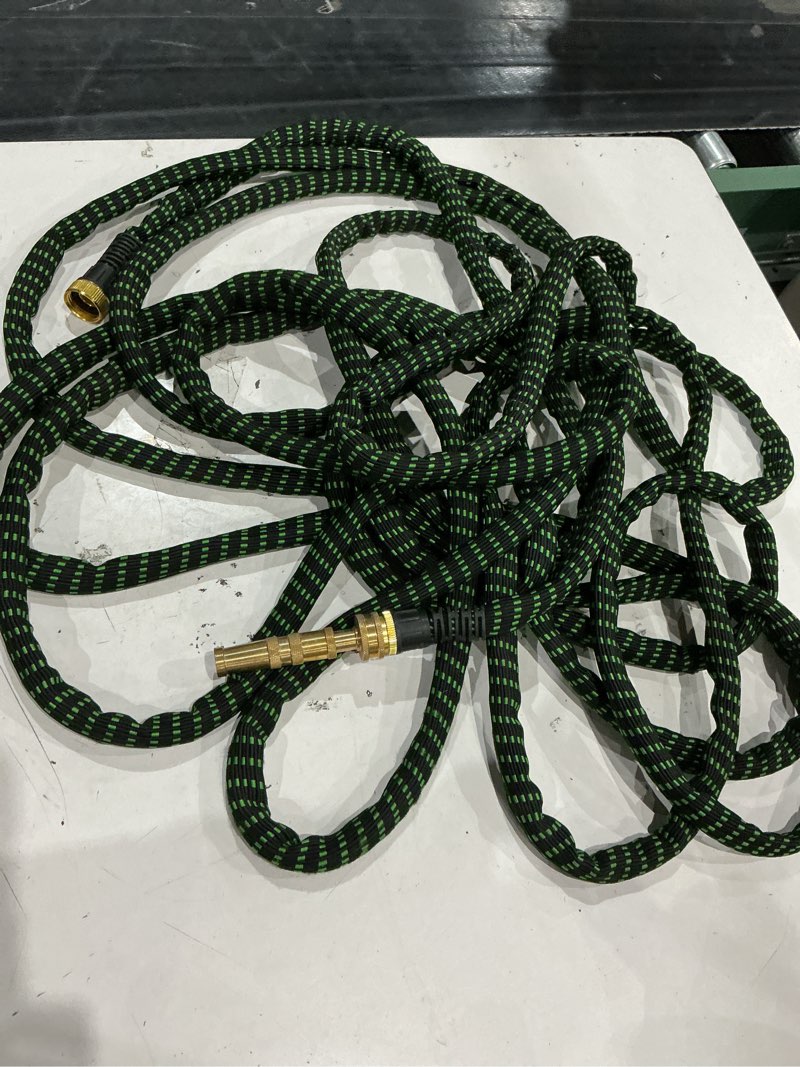 Condition photo showing As Is for incomplete missing pieces. unknown size. flex-able hose xtreme 1-kink free woven green hos