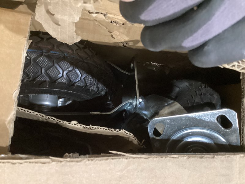 Condition photo showing As Is for 10 Inch Pneumatic Casters Set of 4 (2 Swivel/2 Rigid),Heavy Duty Casters,Tolerable 1300 LBS,Rubber Knobby Tread for Workbench, Cart, Trolley,Wagon and Shelves