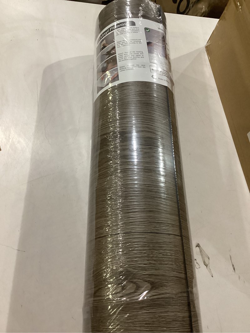 Condition photo showing New/Like New for freshtour vinyl flooring roll, wood grain peel and stick floor tiles 23.6"x 393.7"/64 sq.ft, wear-resistant and waterproof vinyl plank flooring for bedroom living room kitchen rv office, brown 23.6"wx 393.7"l (64 sq.ft) brown 1