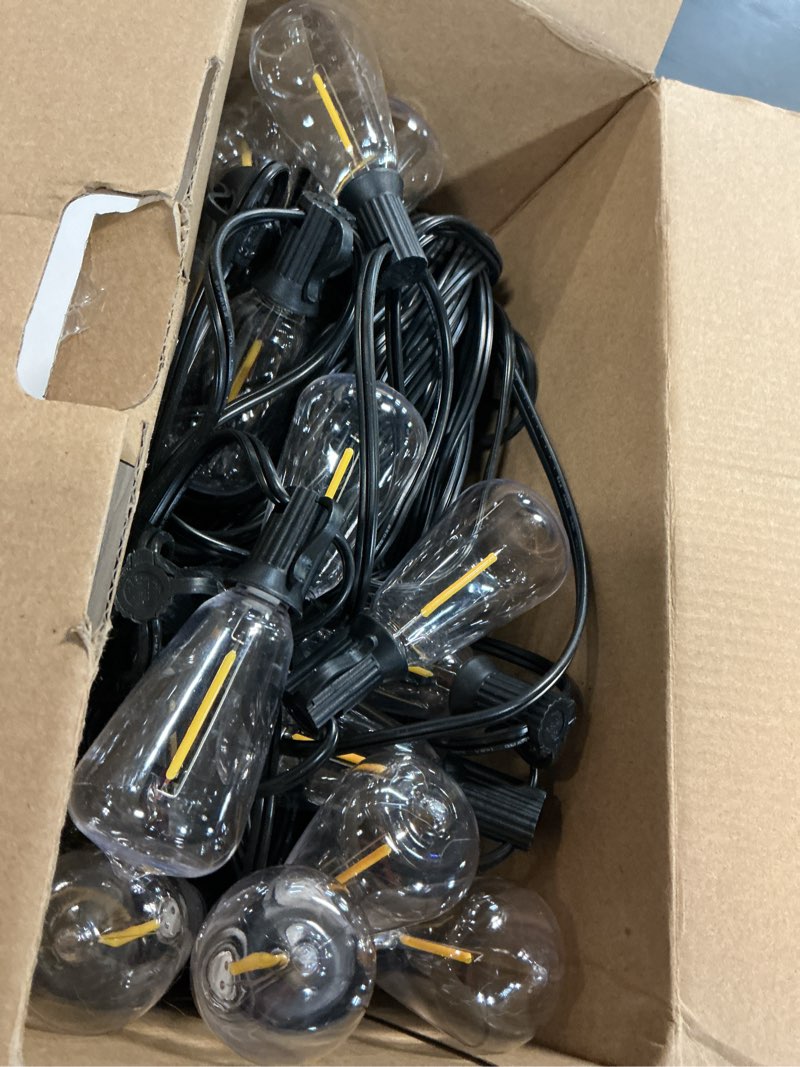 Condition photo showing Good Condition for brightever led outdoor string lights 100ft patio lights with 52 shatterproof st38 vintage edison bulbs, outside hanging light waterproof for porch, deck, garden, backyard, balcony, 2700k dimmable black wire 100ft-warm white