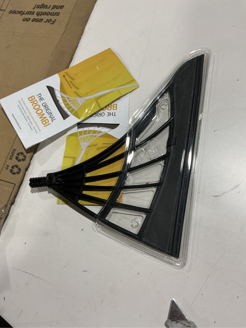 Condition photo showing As Is for Original Broombi - All-Surface Silicone Broom, Squeegee, Pet Hair Remover - Smart Broom for Indoor Cleaning - Cleans Glass, Fine Dust, Hair, Liquids - for Smooth Floors, Rugs, Windows (Black)