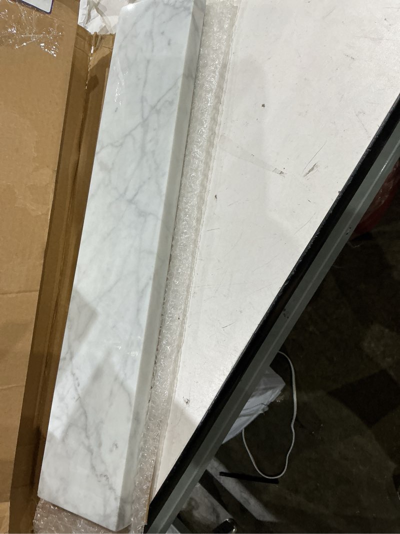 Condition photo showing Good Condition for allen + roth natural carrara marble 4-in h x 21-in l white natural marble bathroom side splash