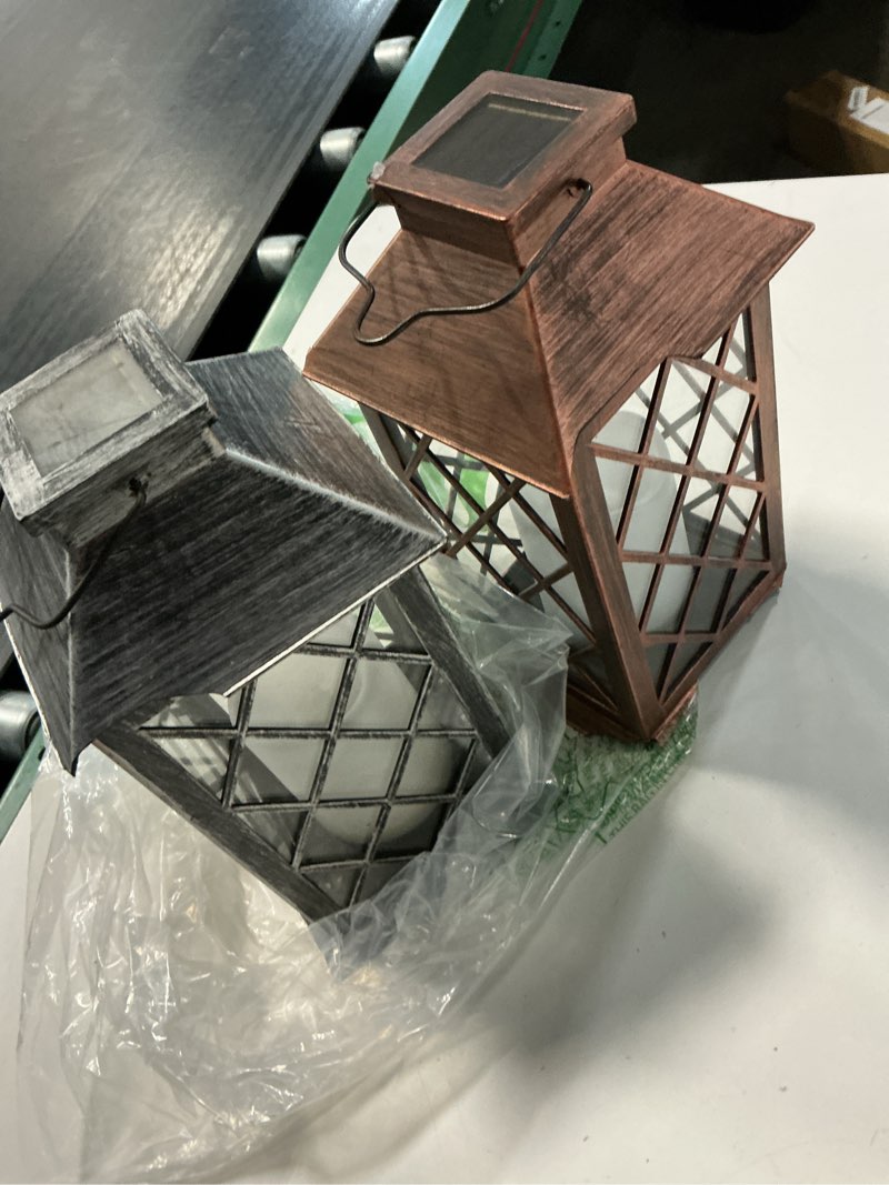 Condition photo showing As Is for homemory solar lanterns outdoor waterproof hanging with flickering flameless candles, 2 pack 13'' garden outdoor lantern decorative for patio front porch backyard balcony cabin outside(antique copper)