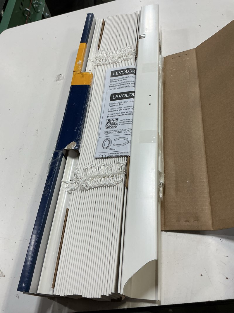 Condition photo showing As Is for levolor trim+go 2-in slat width 23-in x 48-in cordless white faux wood room darkening horizontal blinds
