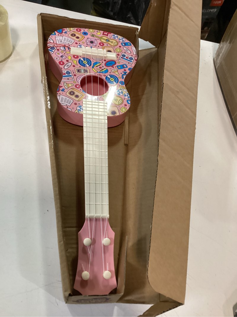 Condition photo showing Good Condition for LeeQee 21in Colorful Graffiti Ukulele Guitar for Kids, 4 Strings Kids Guitar Ukulele Musical Instruments Learning Educational Toys with Picks for 3 4 5 6 7 8 9 10 11 12 Toddler Boys Girls (Pink)