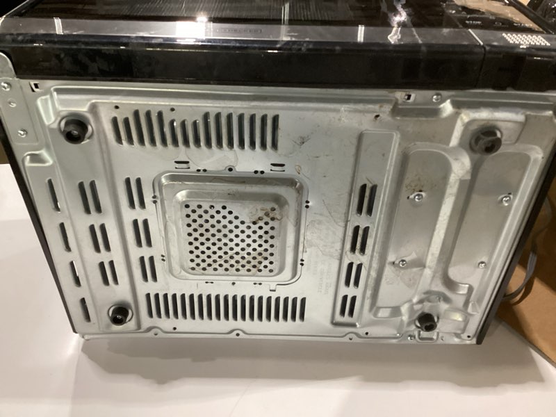 Condition photo showing As Is for BLACK+DECKER EM031MB11 Digital Microwave Oven with Turntable Push-Button Door, Child Safety Lock, 1000W, 1.1cu.ft, Black & Stainless Steel, 1.1 Cu.ft, AS IS/USED, NOT TESTED