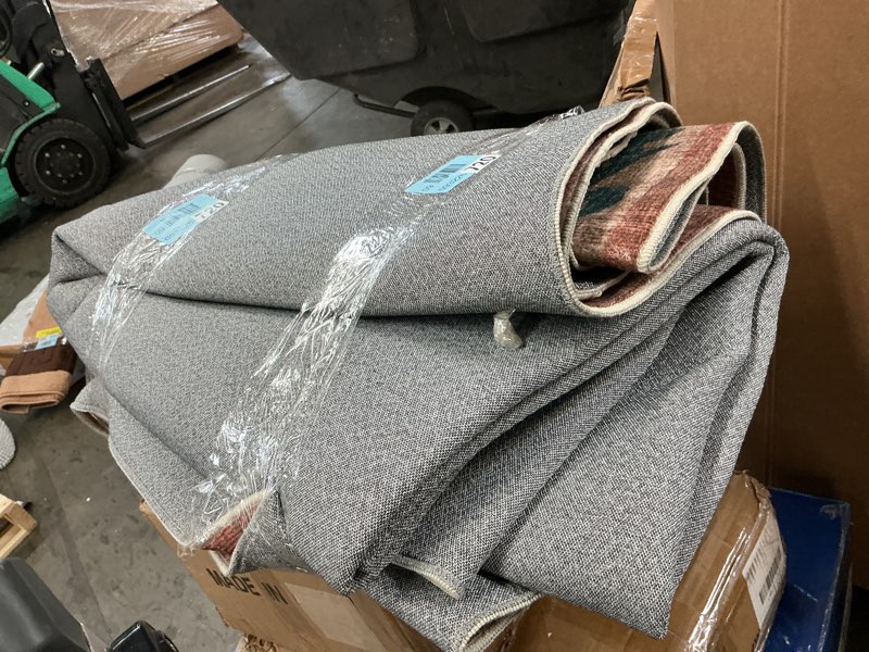 Condition photo showing As Is for multicolored design area rug machine washable
