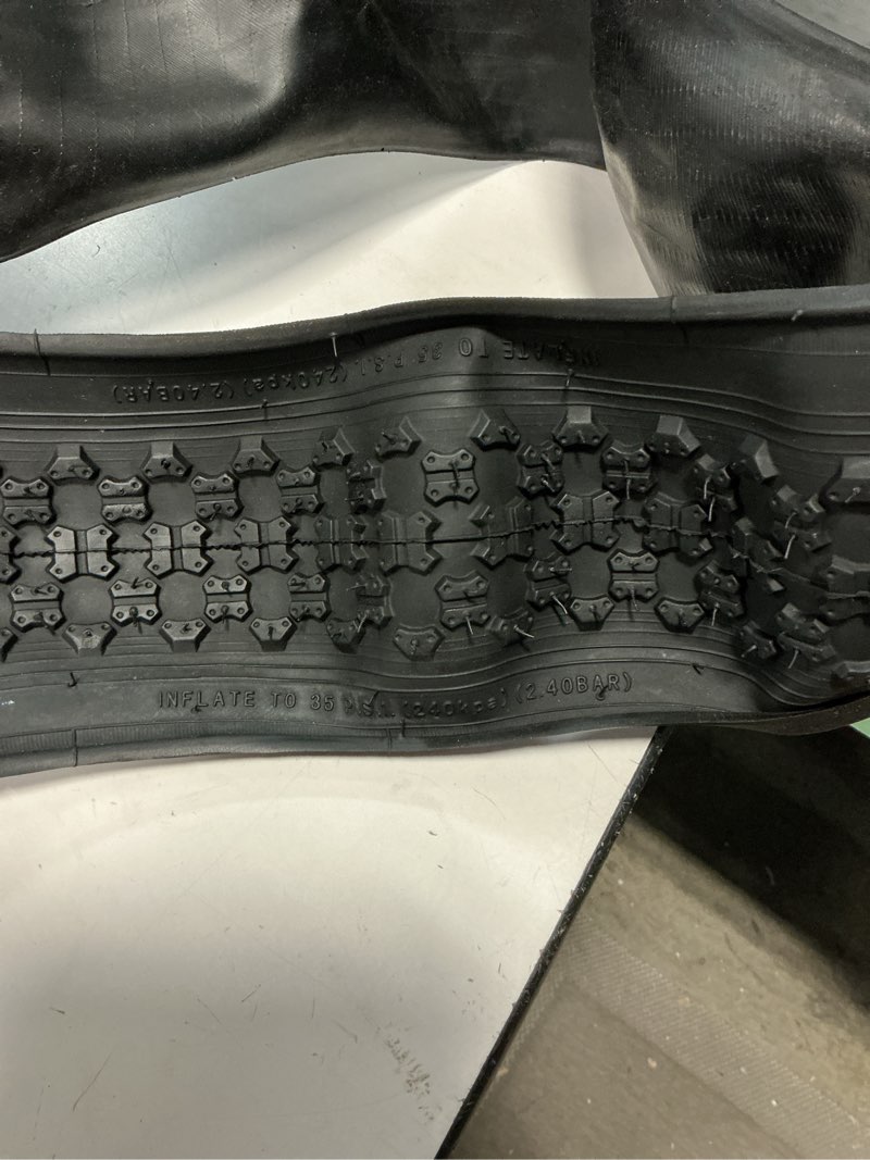 Condition photo showing As Is for 24.5x2.20 rubber slipproof replacement bike tire, high traction tread for mountain road bike black