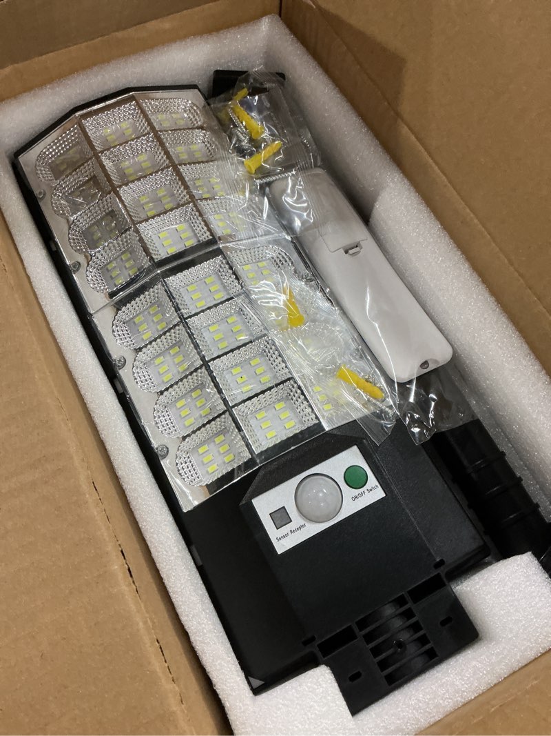 Condition photo showing New/Like New for Solar Street Lights Outdoor Waterproof, 6500K Solar Flood Light with Motion Sensor and Remote Control, Dusk to Dawn Parking Lot LED Lighting, for Outside Garage Yard, 4 Pack Shining Moon-4 Pack