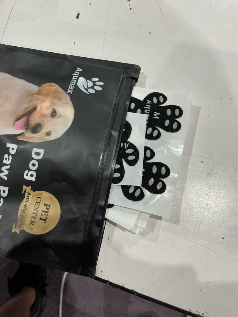 Condition photo showing As Is for dog anti slip paw grips traction pads,dog feet stickers with stronger self-adhesive paw pad provide traction for senior, injured dogs,12 sets (48 pcs) m black black m-1.7*1.5 inch(l*w)