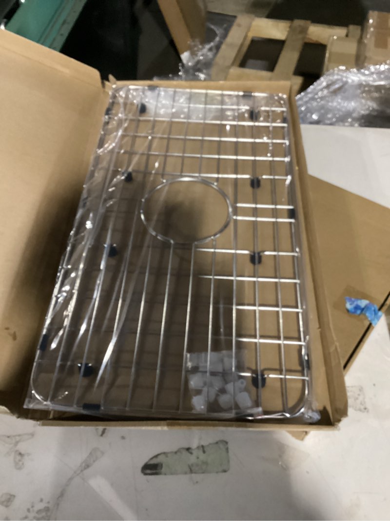 Condition photo showing New/Like New for serene valley sink bottom grid 24-1/8" x 12-5/8", centered drain with corner radius 1-1/2", sink protector nlw2412c