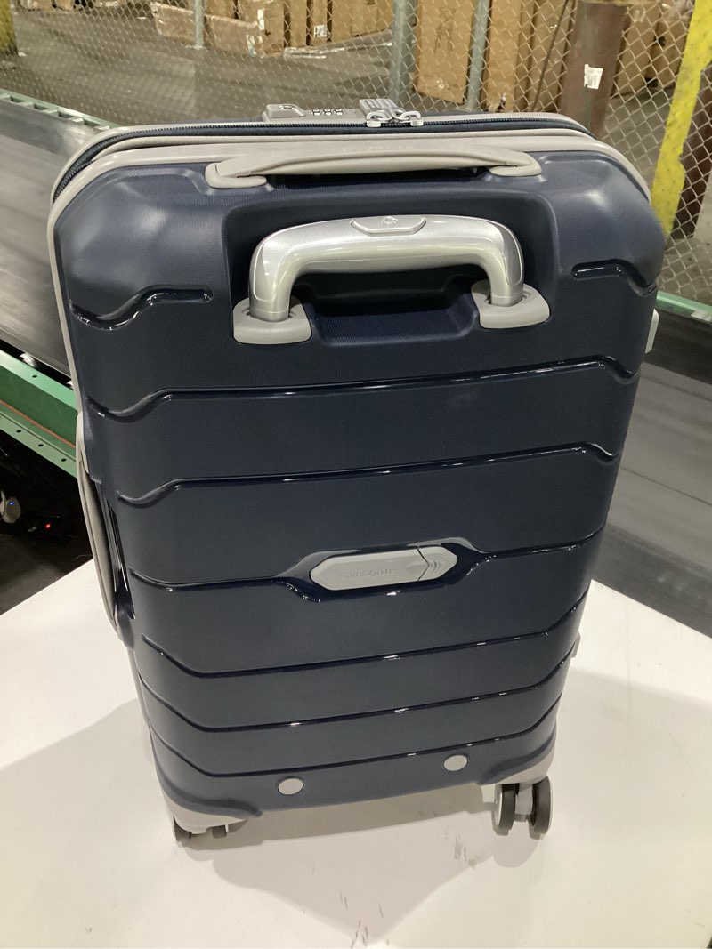 Condition photo showing Good Condition for Samsonite Freeform Hardside Carry-On Luggage with Spinner Wheels - Hardshell Suitcase - TSA, Airline-Approved - Expandable Hard Shell, Smooth Rolling Wheels for Lightweight Travel - Navy Carry-on Spinner Navy