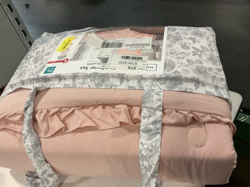 Condition photo showing As Is for mainstays all in one reversible comforter and sheet set- 8 piece, twin, pink and grey ruffle