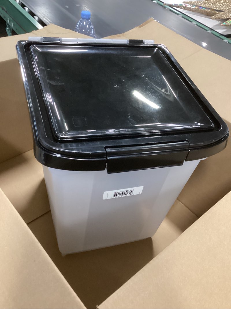 Condition photo showing Good Condition for IRIS USA 25 Lbs / 32.5 Qt WeatherPro Airtight Pet Food Storage Container with Removable Casters  for Dog Cat Bird and Other Pet Food Storage Bin  Keep Fresh  Translucent Body  Clear/Black
