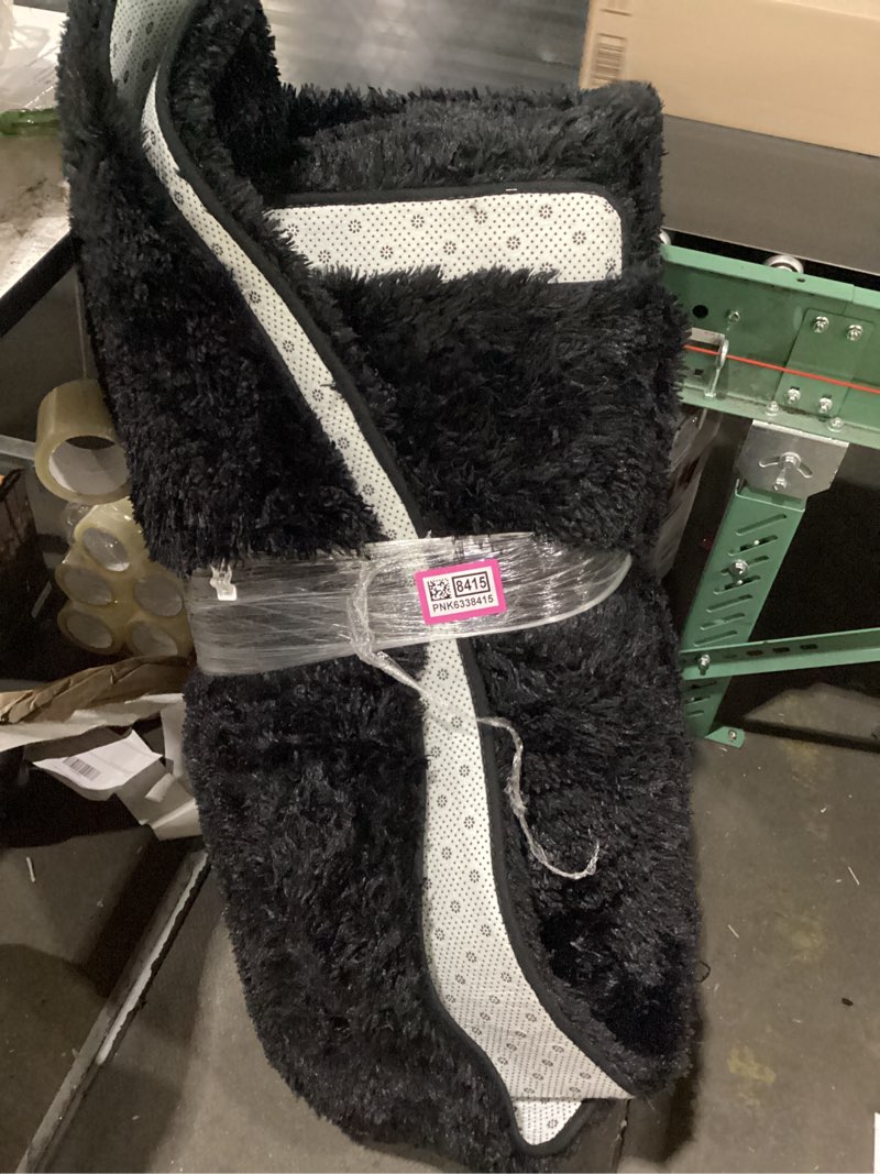 Condition photo showing As Is for large black fluffy area rug