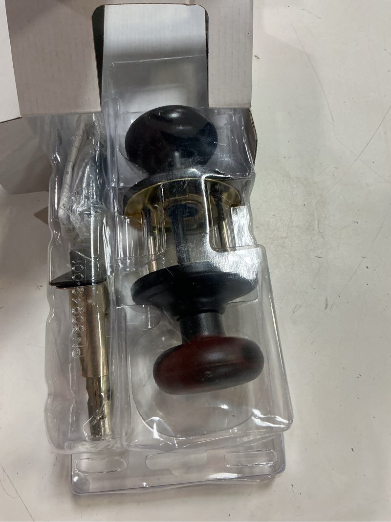 Condition photo showing As Is for kwikset juno venetian bronze passage door knob 1-3/4 in.