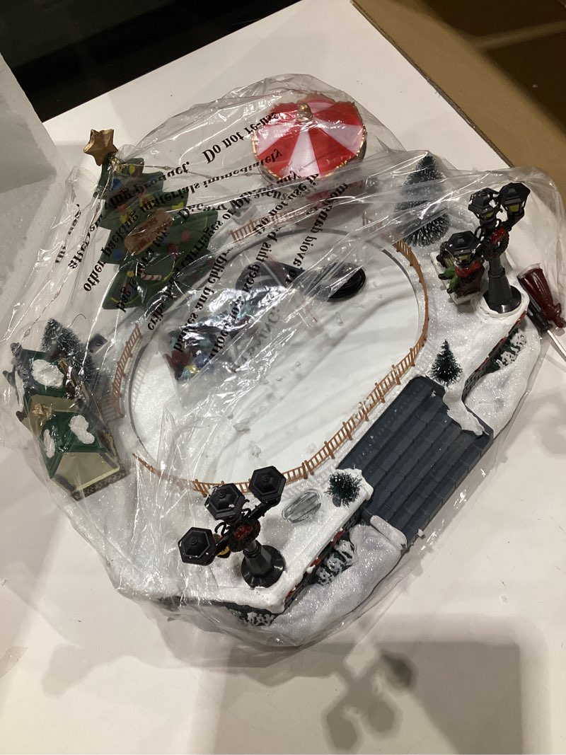 Condition photo showing As Is for Christmas Village Ice Skating Rink Colorful Animated Decorations with 6 Magnetic Moving Skater Figurines Musical Christmas Skating Pond