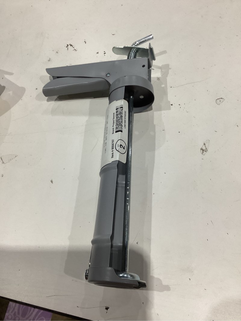Condition photo showing As Is for project source 10 -oz smooth rod caulk gun