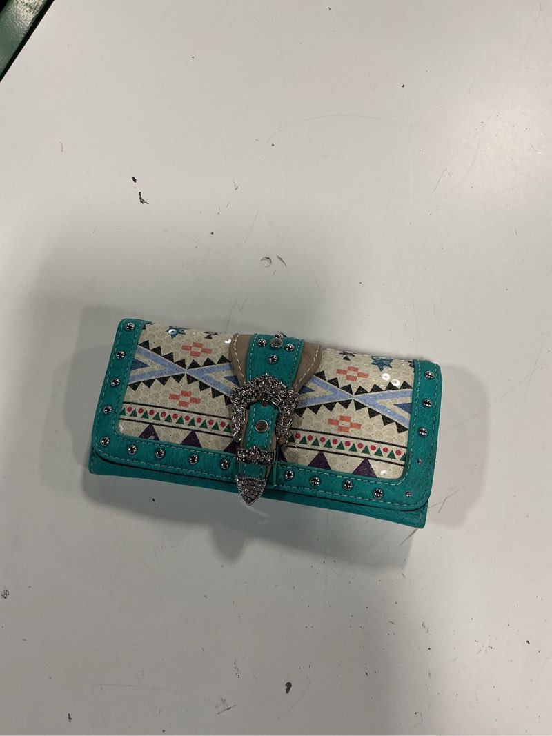 Condition photo showing Good Condition for turquoise and white southwestern-style trifold wallet features an ornate rhinestone-studded buckle (color varies from stock photo)