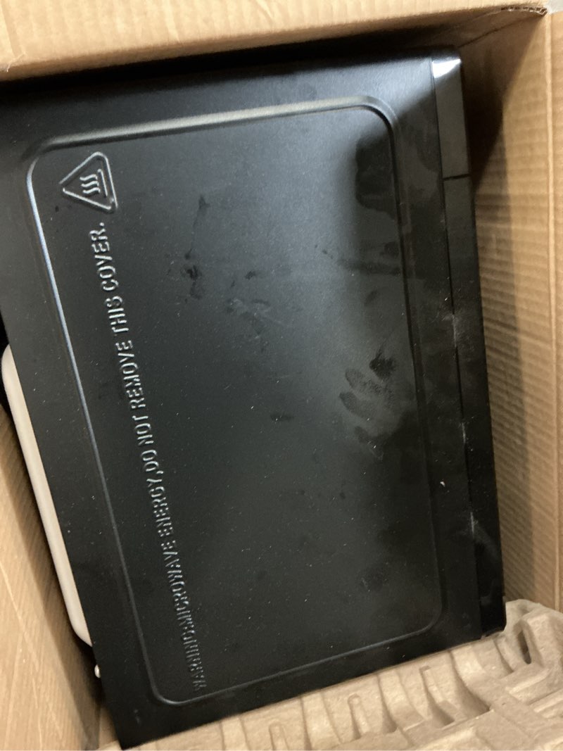 Condition photo showing As Is for mainstays 0.7 cu ft countertop microwave oven, 700 watts, black