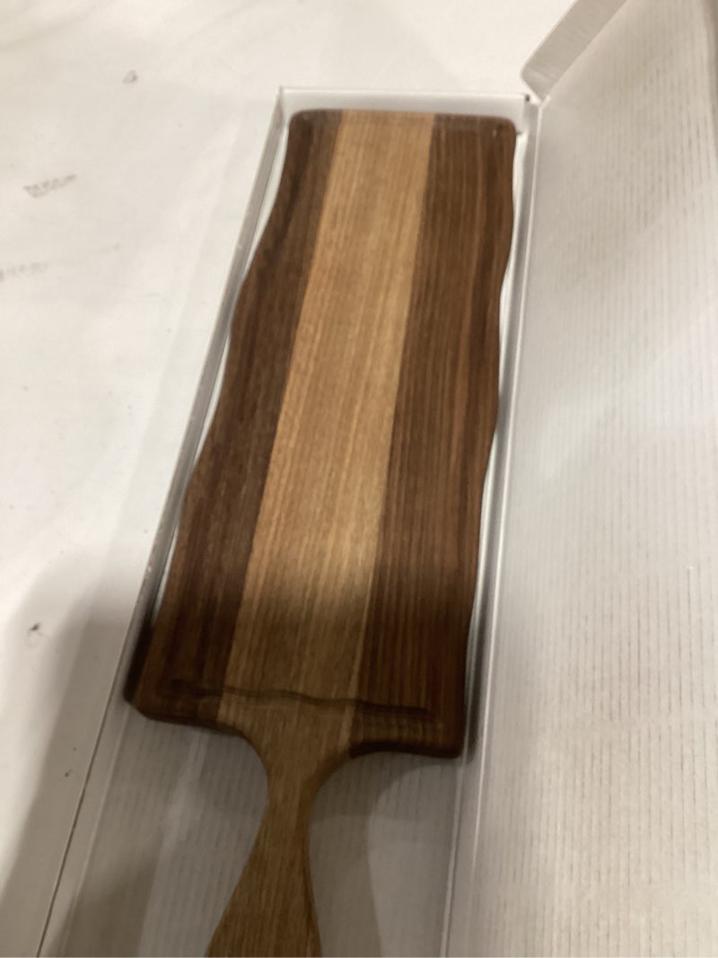 Condition photo showing New/Like New for Elegant American Black Walnut Wood Long Serving Board with Handle - Charcuterie Wooden Board - Stylish Versatility for Culinary Delights - Reversible with Juice Groove - 19x6x0.8 in - Woodie Poppins 19" x 6" x 0.8"