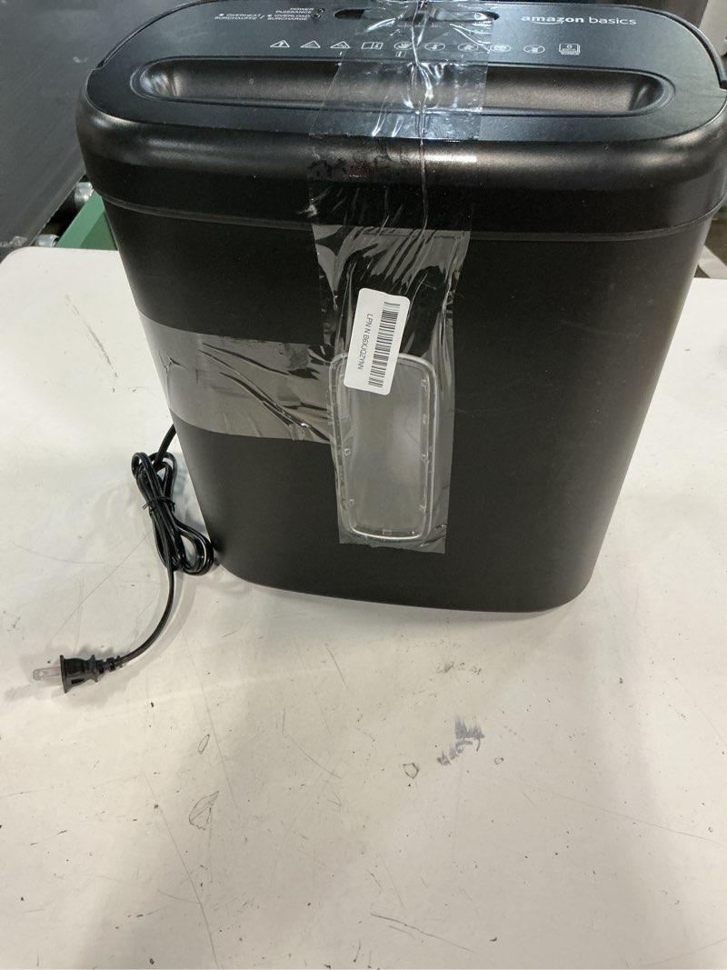Condition photo showing As Is for amazon basics 8-sheet high security cross cut paper and credit card shredder with p-4 security, auto shut-off, black 8 sheet black