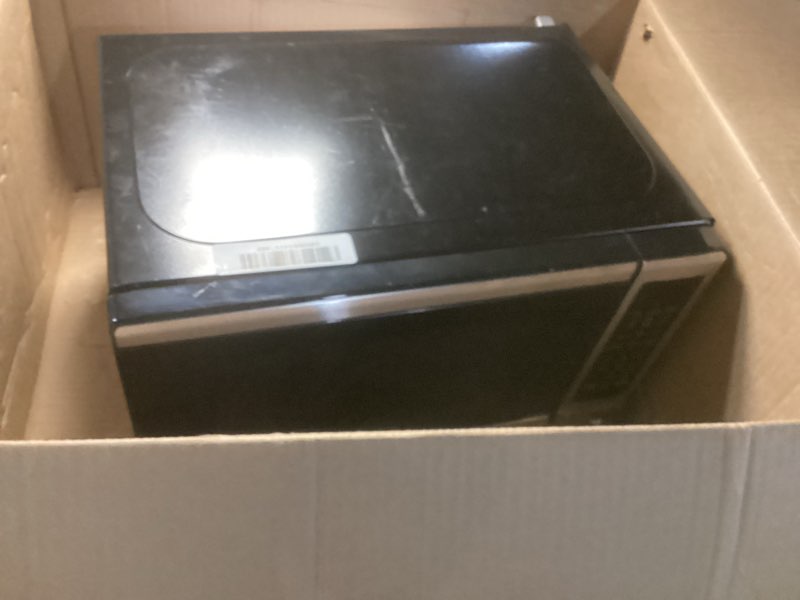 Condition photo showing As Is for black+decker em720cb7 digital microwave oven with turntable push-button door, child safety lock, 700w, stainless steel, 0.7 cu.ft 0.7 cu. ft.