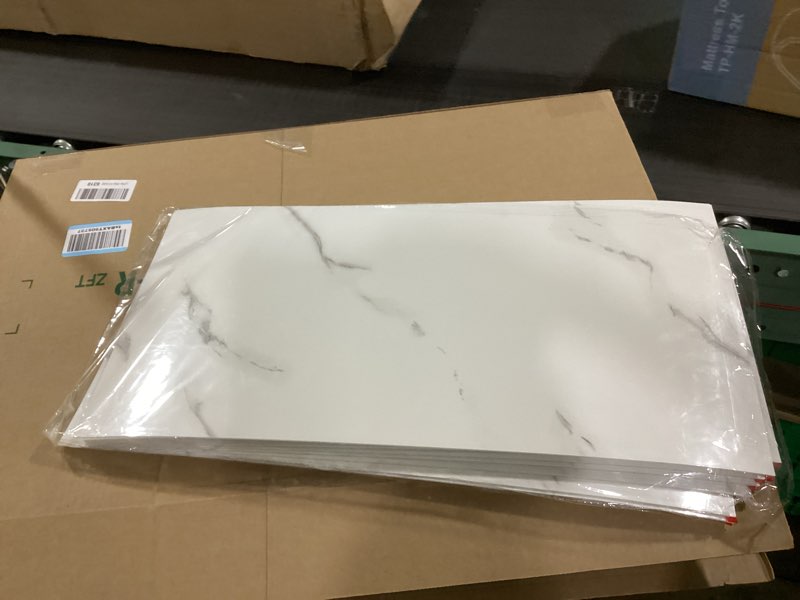 Condition photo showing Good Condition for WADILE 23.6\"x11.8\" Waterproof Marble Peel and 12 Stick Wall Panels Marble Tile PVC Backsplash Tiles for Kitchen, Bathroom, Living Room, Bedroom 10 (+ 2 ) Pack White