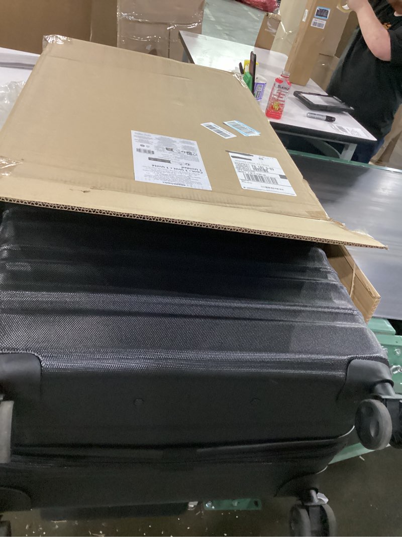 Condition photo showing Good Condition for amazon basics 30" hardside large checked luggage, hardshell suitcase with wheels, expandable for up to 15% more space, with scratch-resistant surface, four multi-directional wheels, black black large checked