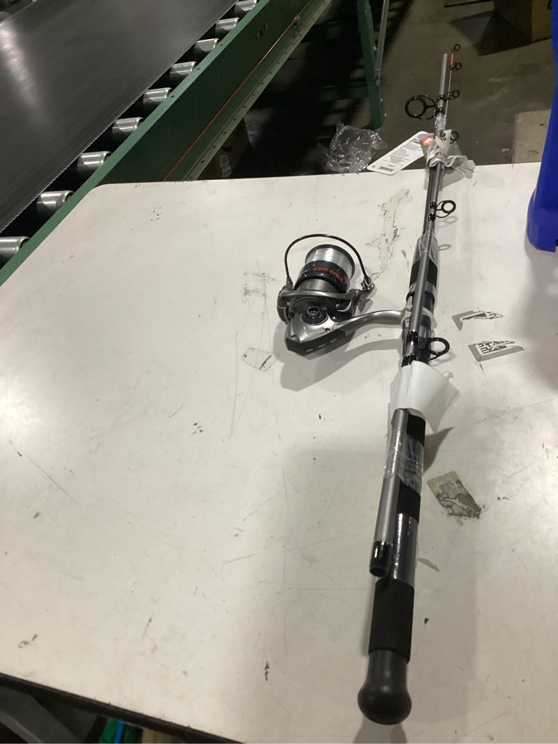 Condition photo showing As Is for ozark trail grit stick fishing rod and reel spinning combo, 7-foot medium heavy action 2-piece fishing rod, size 5000 reel, left/right hand retrieve, grey with orange