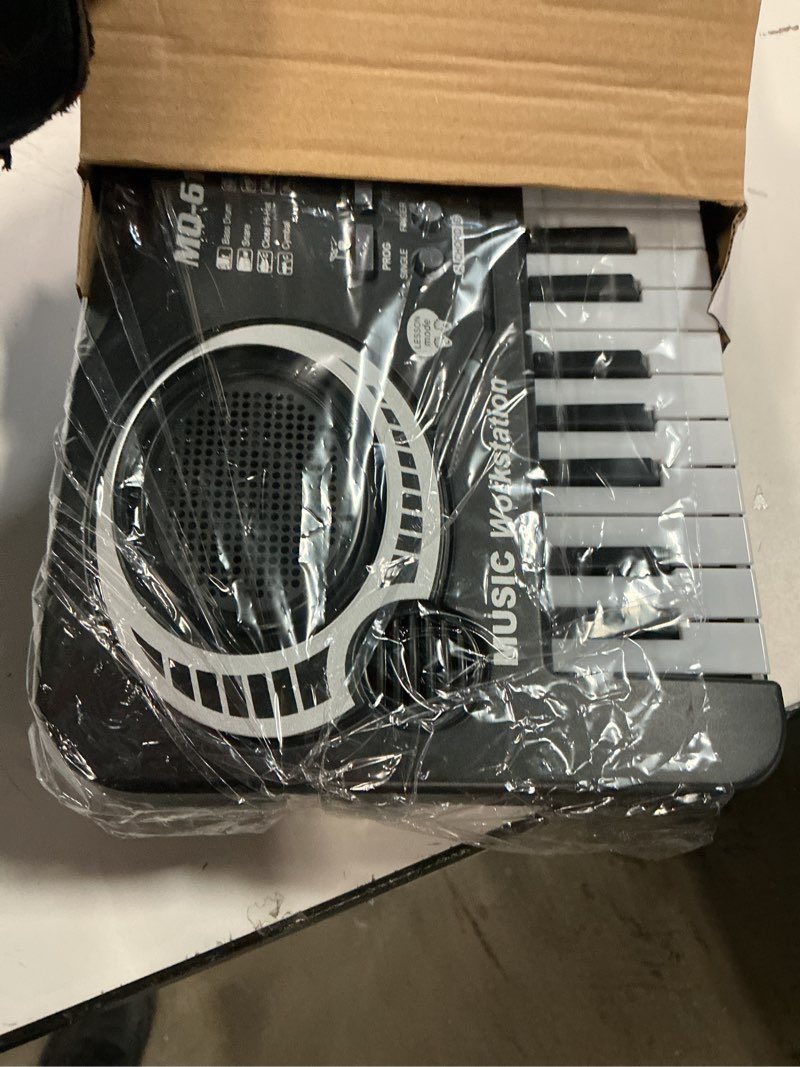Condition photo showing As Is for 61 Key Piano Keyboard, Beginner Electronic Keyboard for Kids with Teaching Mode, 6 Demo Songs, 16 Tones, Microphone and Power Supply, Kids Piano Keyboard for Birthday Gift/Christmas Gift Black