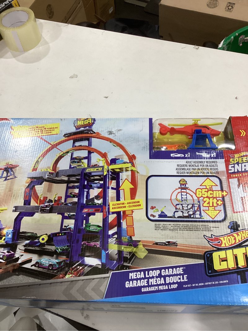 Condition photo showing New/Like New for Hot Wheels Toy Car Track Set with Die-Cast Car & Helicopter, 2 Loops, Storage for 36 1:64 Scale Vehicles, Speed Snap Adapters, Mega Loop Garage