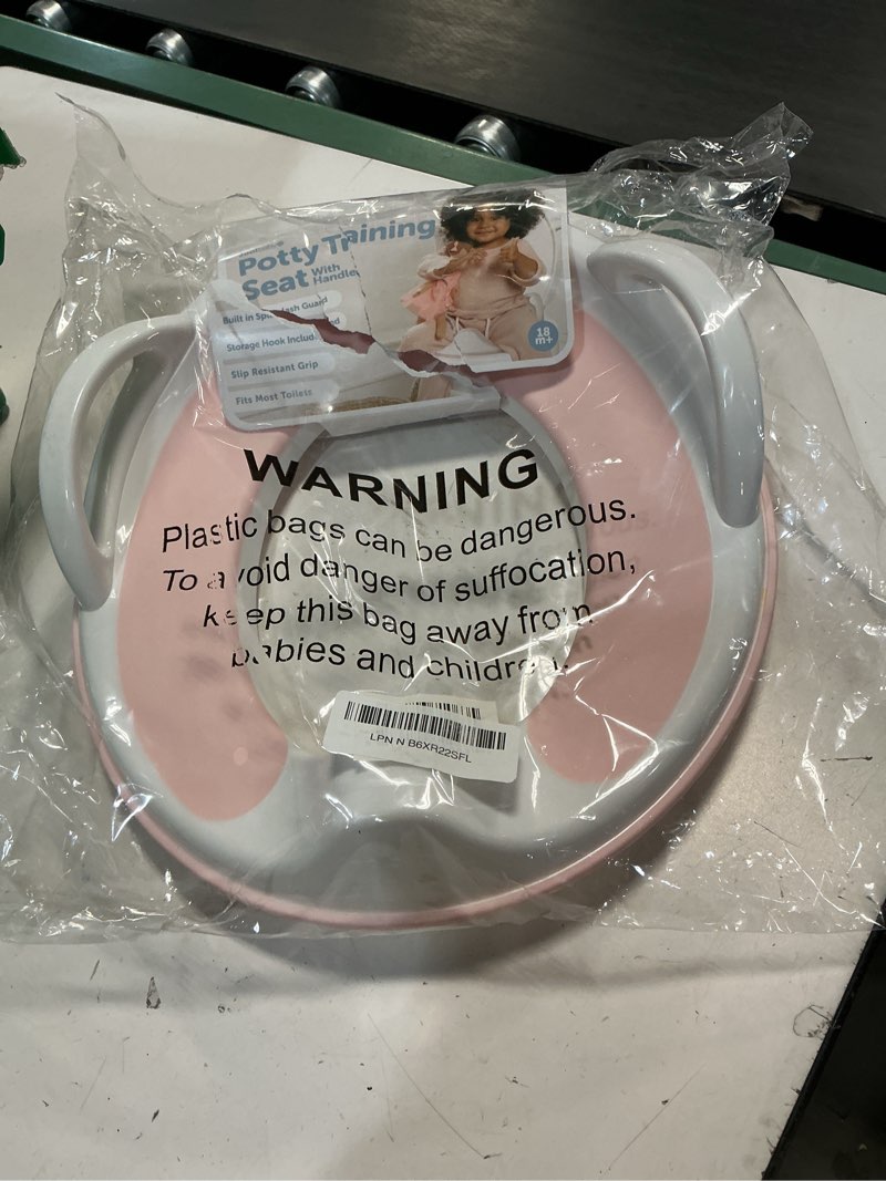 Condition photo showing New/Like New for jool baby potty training seat for boys and girls with handles, fits round & oval toilets, non-slip with splash guard, includes free storage hook (pink)