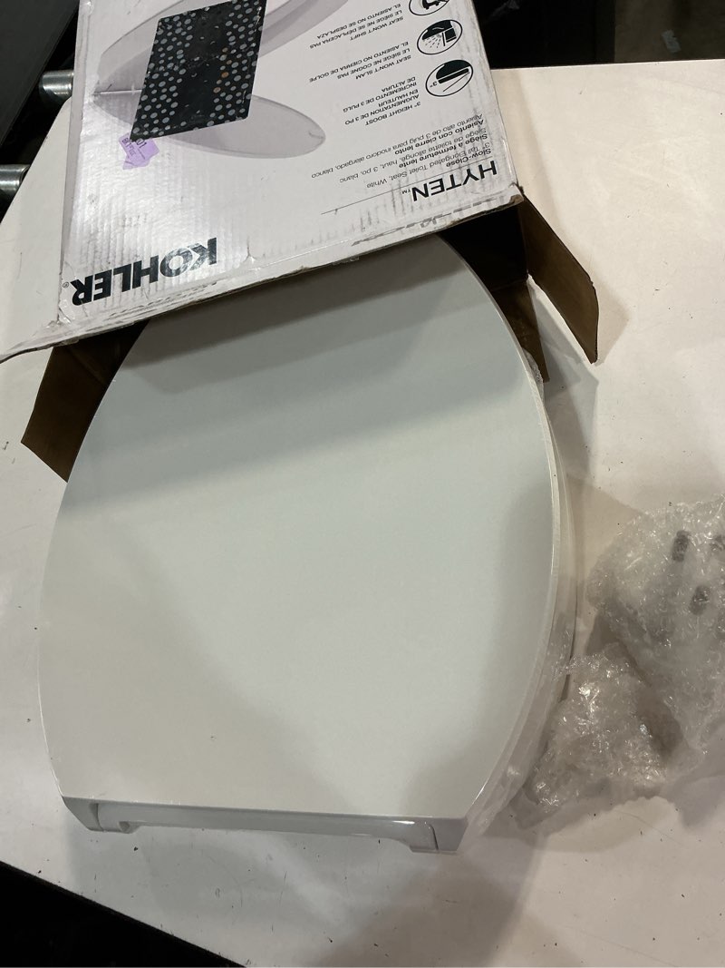 Condition photo showing New/Like New for kohler 25875-0 hyten 3" height, elevated soft close elongated toilet seat, contoured seat with grip-tight bumpers, quick-attach hardware, no slam toilet seat, white white elongated