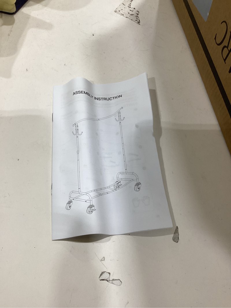 Condition photo showing As Is for raybee heavy duty clothes rack 75" extra wide, 450 lbs clothing rack with 4 hooks, lockable wheels, metal garment rack for bedroom, laundry room, commercial chrome rod shelf