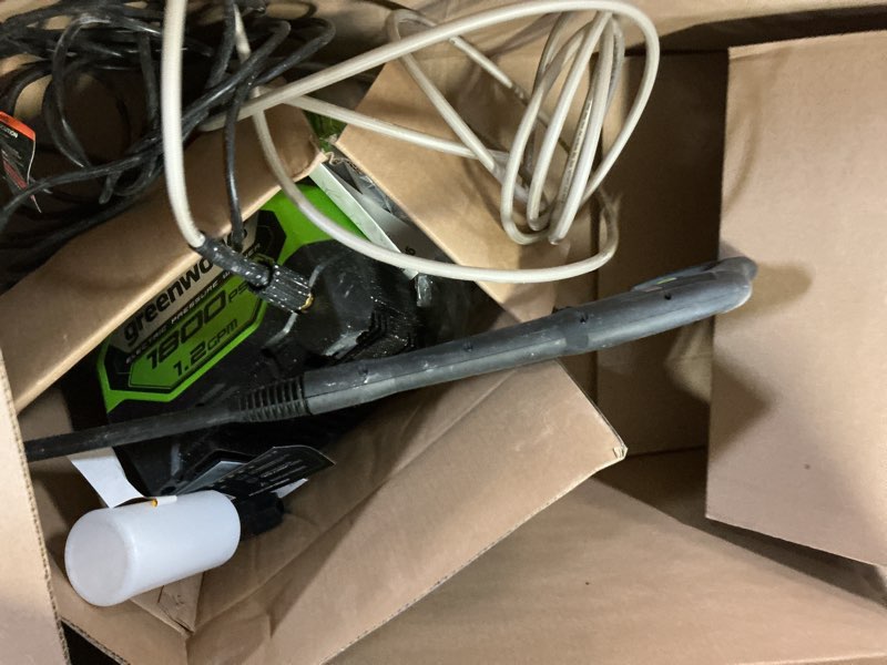 Condition photo showing As Is for greenworks 1800 psi 1.2-gpm cold water electric pressure washer with 2 spray tips