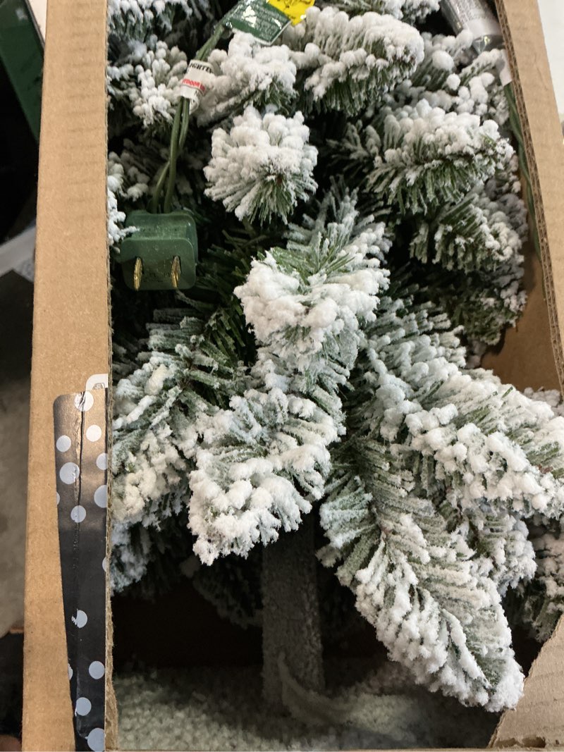 Condition photo showing Good Condition for national tree company 3 ft pre-lit flocked downswept forestree mini artificial christmas tree,50 clear lights, 198 tips, metal plate base, green 3ft tree