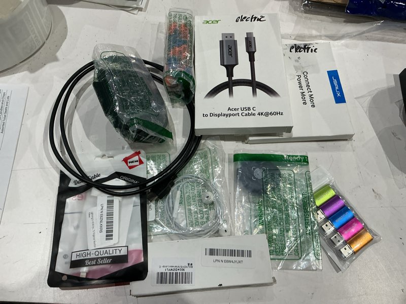 Condition photo showing As Is for assorted lot of electronics (headphones, small gadgets, headsets, etc.) 