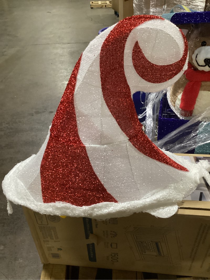 large, glittery, red and white striped hat outside decoration