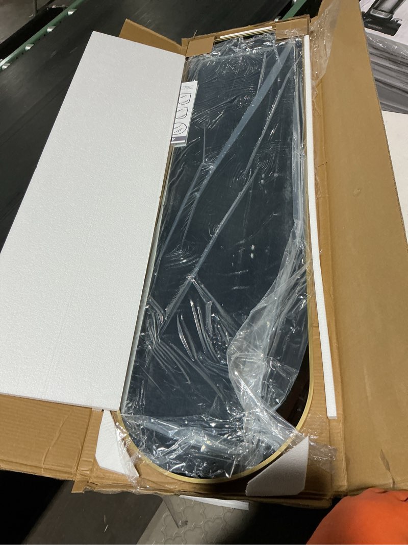 Condition photo showing Good Condition for arched full length mirror, 56"x15" standing body mirror for wall, with aluminum alloy frame for bedroom, living room, dressing room(gold) gold 56"l x 15"w