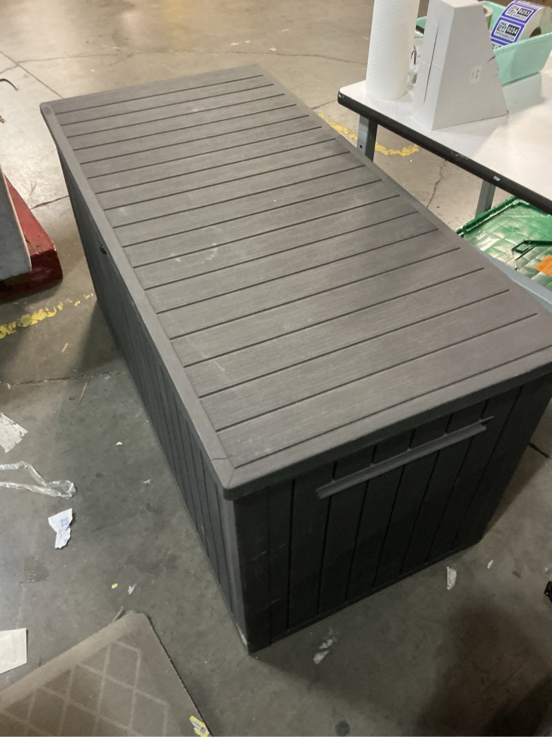 Condition photo showing As Is for 170-gallon outdoor storage deck box, weather-resistant, (graphite)