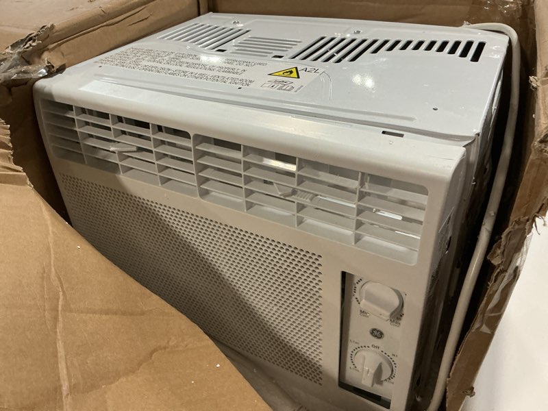 Condition photo showing As Is for ge window air conditioner unit, 5,000 btu for small rooms up to 150 sq ft. with manual adjustable fan and cooling settings, perfect for small bedroom or living room, easy install kit included, white new 5,000 btu mechanical controls white
