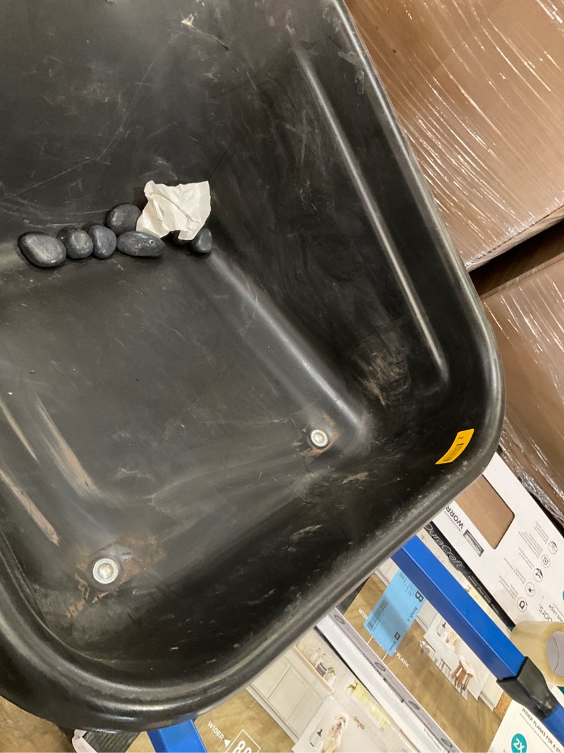 Condition photo showing As Is for wheelbarrow