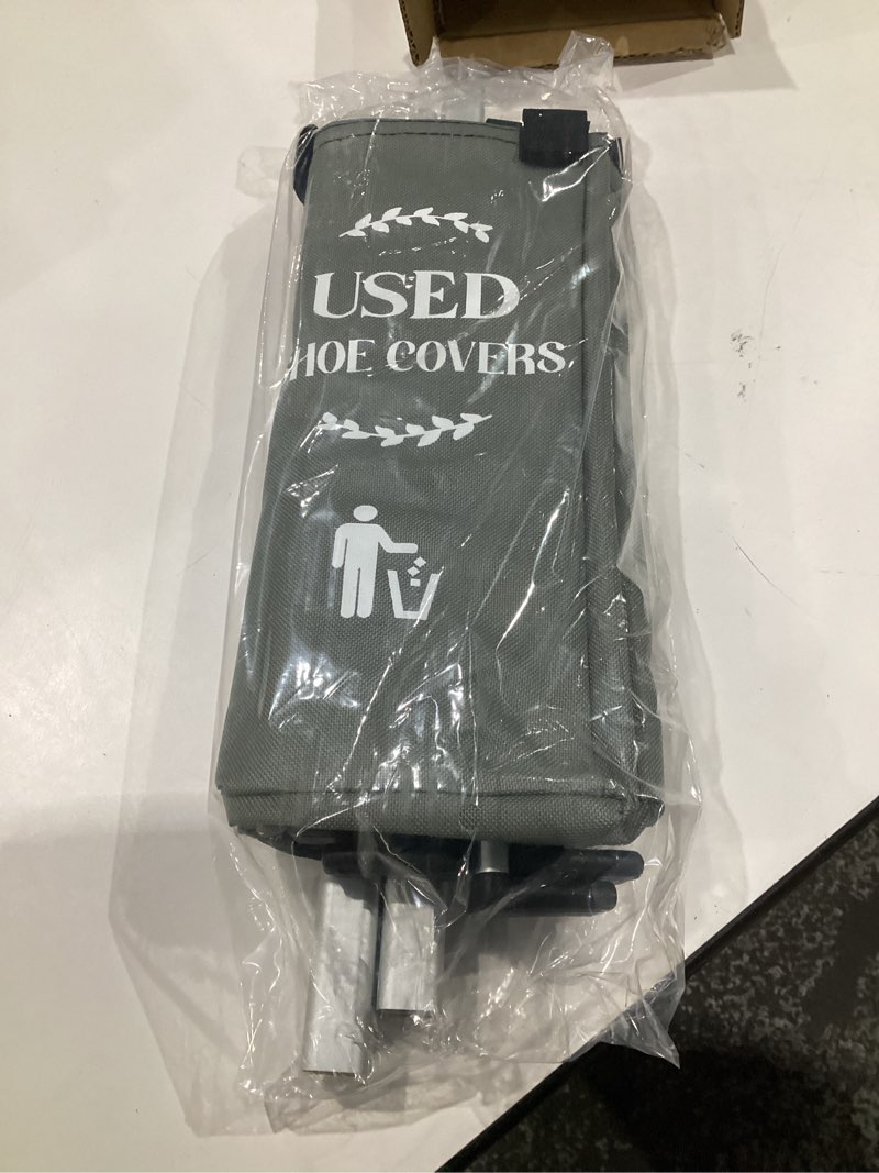 Condition photo showing Good Condition for foldable disposable shoe cover box dispenser fabric storage bin holder with used shoe covers and welcome please or remove sign for open house supplies(black, gray)