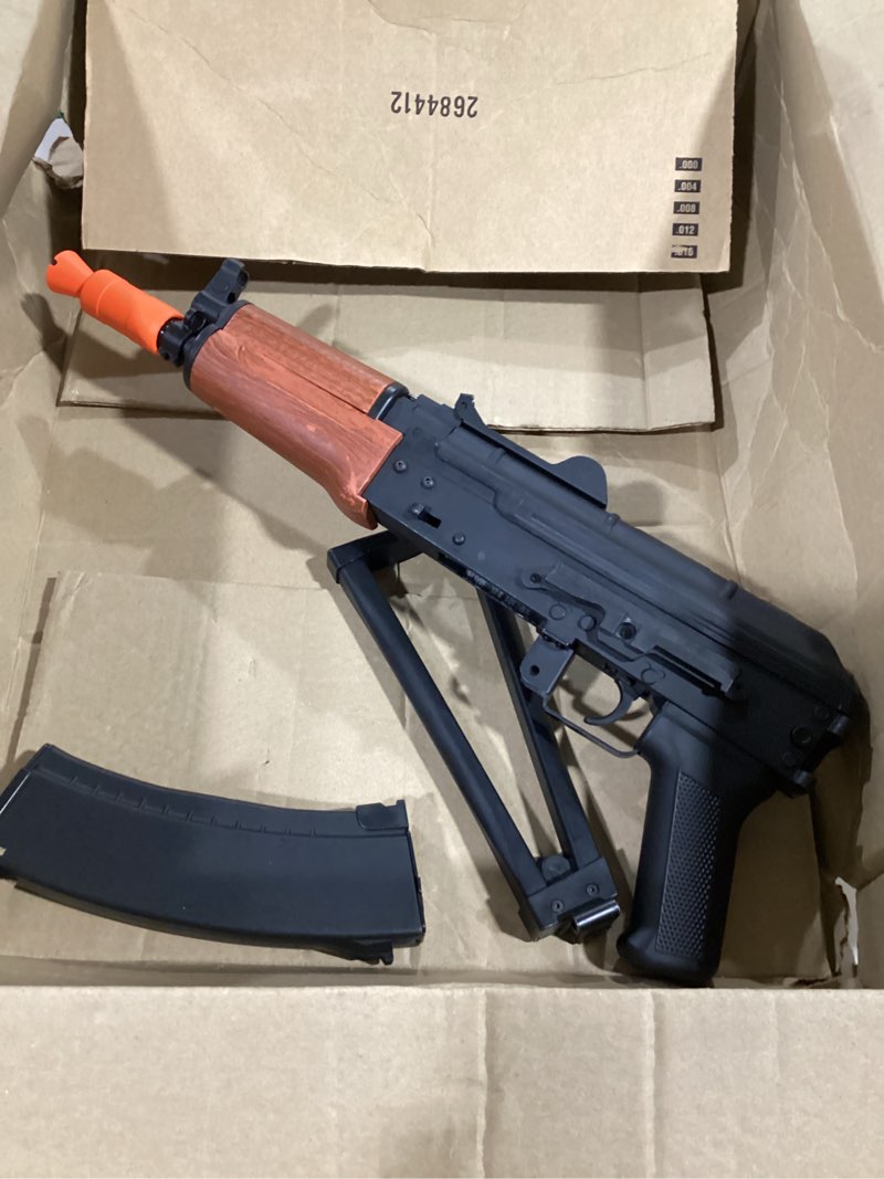 Condition photo showing As Is for emerbu pro-grade gel splatter ball blaster aks74u upgraded by emerbu - metal and nylon body - 11.1v high power - metal gearset - high speed motor - for ages 15+ adults