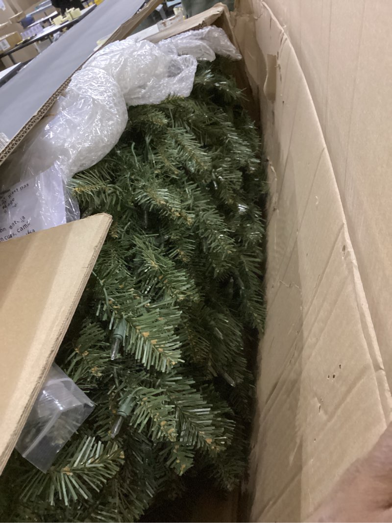 Condition photo showing As Is for Puleo International 7.5ft Pre-Lit Slim Fraser Fir Christmas Tree with 350 Clear Lights, 1188 Realistic Dense Branch Tips, Easy Setup Artificial Trees with Sturdy Metal Stand 7.5' Pencil Fraser Fir with 350 Clear Lights