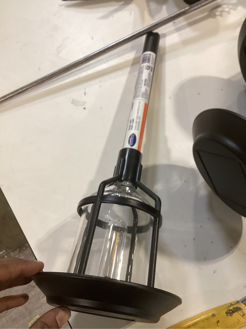 Condition photo showing As Is for harbor breeze path light 15 -lumens 0.2 -watt black solar led outdoor path light ( 3000-k )
