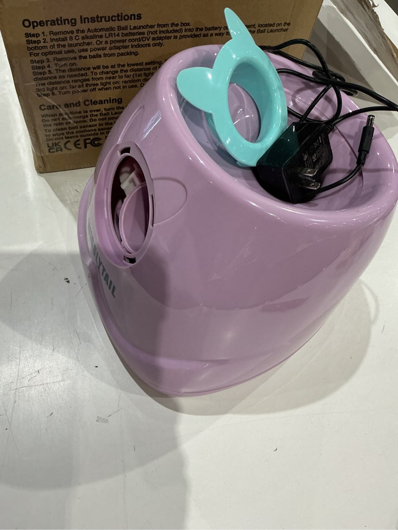 Condition photo showing As Is for automatic dog ball launcher, dog ball fetch machine with remote control, auto ball thrower for small dogs and puppies, pet self playing toys, indoor and outdoor interactive toys with 10 balls remote launcher-pink